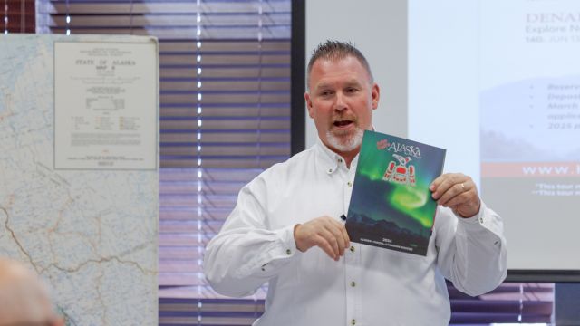 Matt with brochure -seminar image